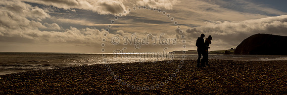 Lovers walk along the beach